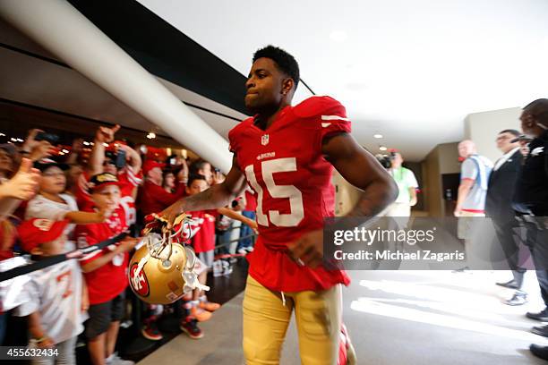 Michael Crabtree of the San Francisco 49ers walks through the stadium club on his way to the field prior to the game against the Chicago Bears at...