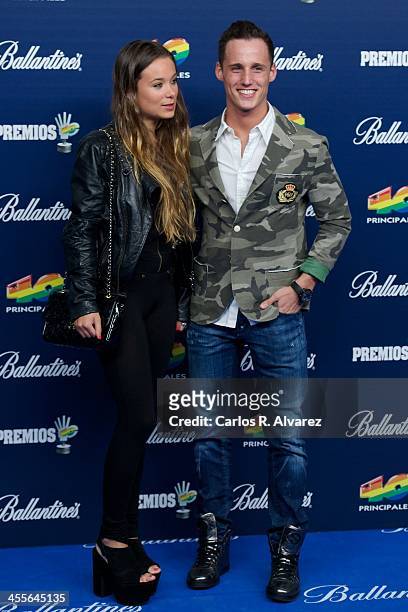 Pol Espargaro and Carlota Beltran attend the "40 Principales Awards" 2013 photocall at Palacio de los Deportes on December 12, 2013 in Madrid, Spain.