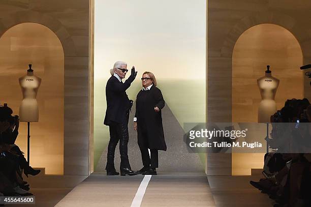 Karl Lagerfeld and Silvia Venturini Fendi acknowledge the applause of the audience after the Fend show as a part of Milan Fashion Week Womenswear...
