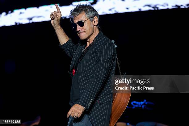 Luciano Ligabue or simply "Ligabue", an Italian singer-songwriter and film director performs live concert at the Olympic Stadium in Turin for...