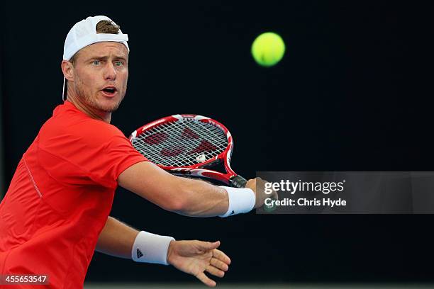 Lleyton Hewitt hits a backhand during a practice session at Pat Rafter Arena on December 13, 2013 in Brisbane, Australia.