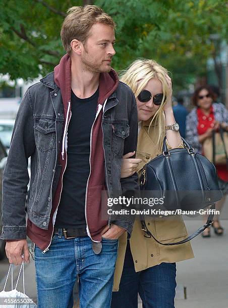 Dakota Fanning and boyfriend Jamie Strachan out in downtown Manhattan. On September 16, 2013 in New York City.