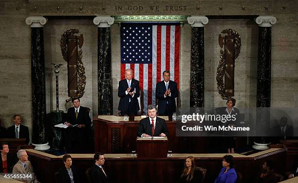 Ukrainian President Petro Poroshenko, flanked by U.S. Vice President Joe Biden and Speaker of the House John Boehner , addresses a joint meeting of...