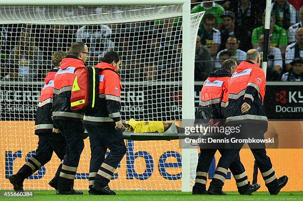 Ikechukwu Uche of Villareal CF is treated after suffering an injury scoring the first goal during the UEFA Europa League Group A match between...