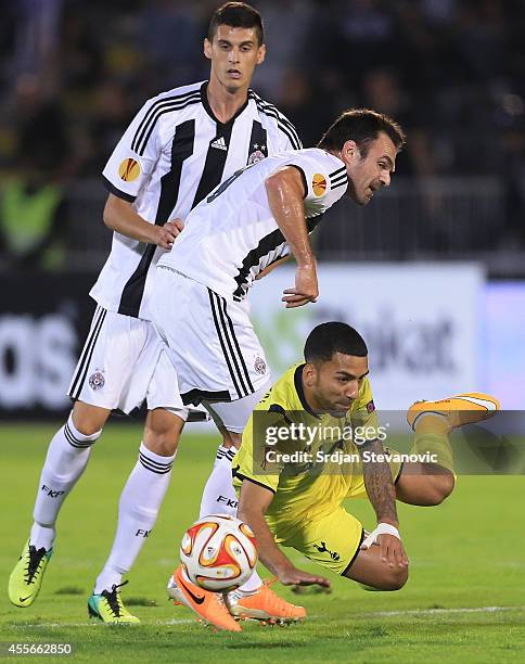 Aaron Lennon of Tottenham Hotspur is fouled by Nikola Drincic of Partizan during the UEFA Europa League match between Partizan and Tottenham Hotspur...