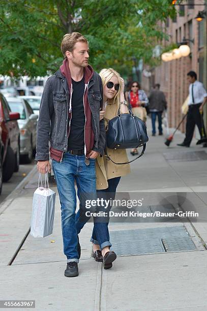 Dakota Fanning and boyfriend Jamie Strachan out in downtown Manhattan. On September 16, 2013 in New York City.