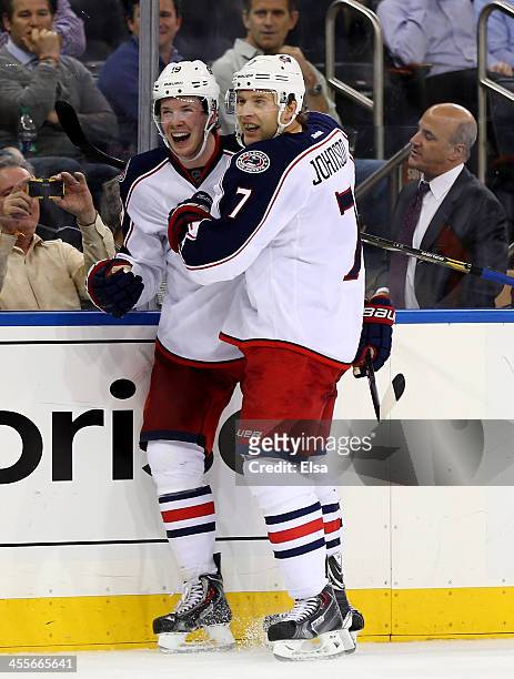 Ryan Johansen of the Columbus Blue Jackets is congratulated by teamamte Nick Foligno after Johansen scored in the third period against the New York...