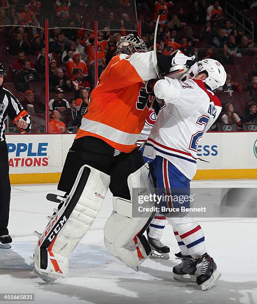 Steve Mason of the Philadelphia Flyers hits Brian Gionta of the Montreal Canadiens at the closing buzzer during the Flyers 2-1 victory over the...