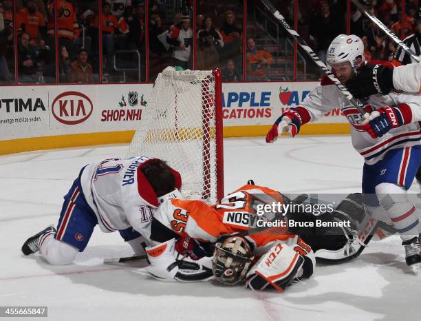 Steve Mason of the Philadelphia Flyers fights with Brendan Gallagher of the Montreal Canadiens at the closing buzzer during the Flyers 2-1 victory...