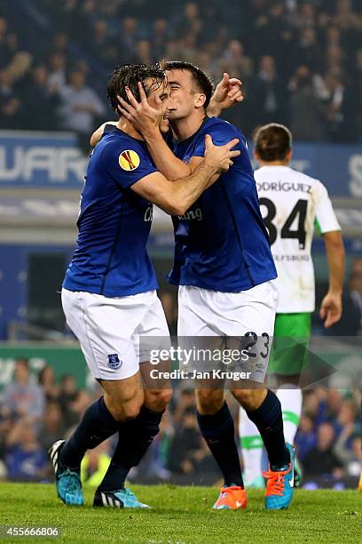 Seamus Coleman of Everton celebrates with teammate Leighton Baines of Everton after scoring his team's second goal during the UEFA Europa League...