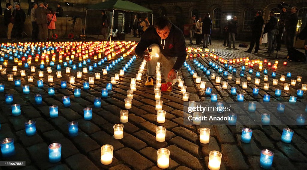 Candles in shape of Catalan's flag and Scottish flag around the St Gilles Cathedral