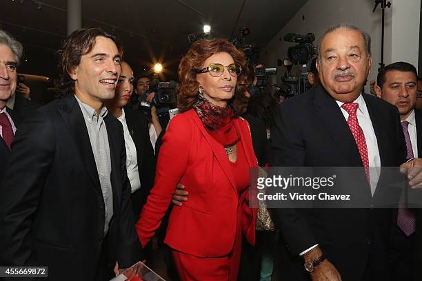 Carlo Ponti, actress Sophia Loren and Carlos Slim Helú walk during the opening of Sophia Loren's exhibition that is part of the events to celebrate...