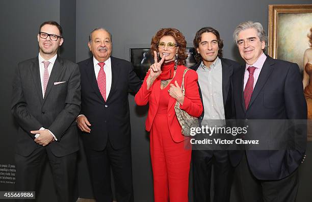 Carlos Slim Helú, actress Sophia Loren, Carlo Ponti and Rafael Tovar walk during the opening of Sophia Loren's exhibition that is part of the events...