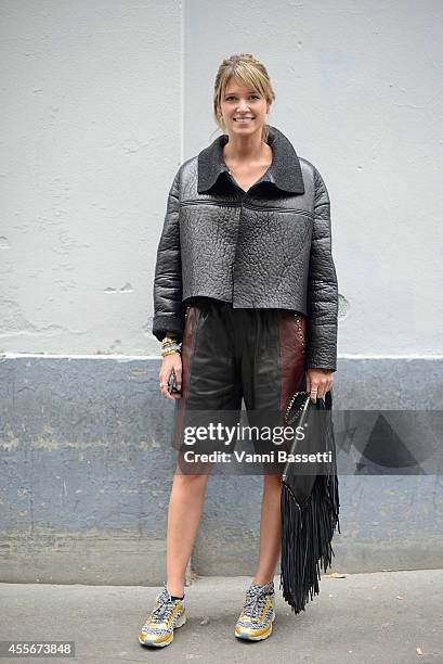 Fashion blogger Helena Bordon poses wearing a Cavalli jacket and pants, Chanel shoes and Barbara Bonner bag on September 18, 2014 in Milan, Italy.