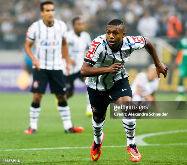 Malcom of Corinthians celebrates their first goal during the match between Corinthians and Chapecoense for the Brazilian Series A 2014 at Arena...