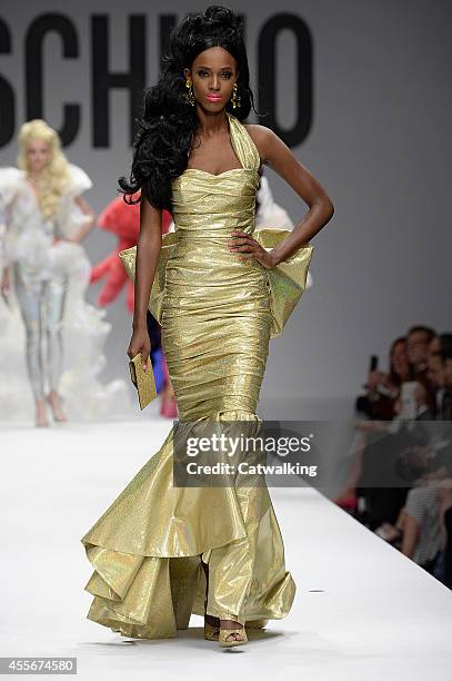 Model walks the runway at the Moschino Spring Summer 2015 fashion show during Milan Fashion Week on September 18, 2014 in Milan, Italy.