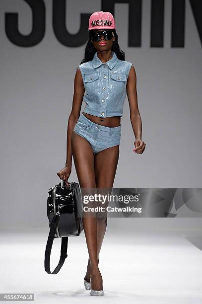 Model walks the runway at the Moschino Spring Summer 2015 fashion show during Milan Fashion Week on September 18, 2014 in Milan, Italy.