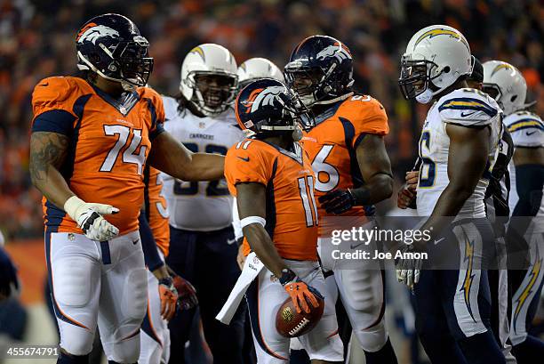 Denver Broncos wide receiver Trindon Holliday jaws with San Diego Chargers inside linebacker Donald Butler during the second quarter. The Denver...