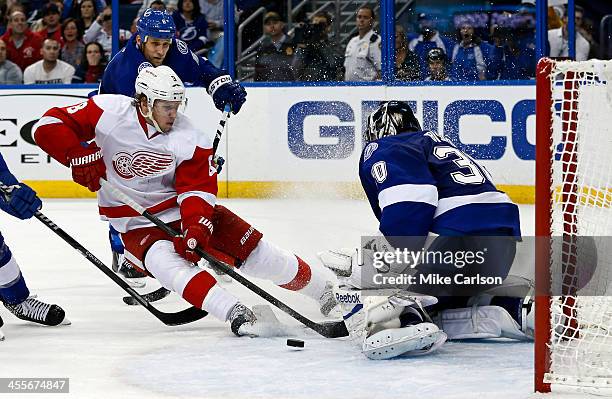 Ben Bishop of the Tampa Bay Lightning makes a save on Justin Abdelkader of the Detroit Red Wings as he's defended by Sami Salo at the Tampa Bay Times...