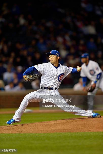 Starting pitcher Tsuyoshi Wada of the Chicago Cubs delivers a pitch during the first inning against the Los Angeles Dodgers at Wrigley Field on...