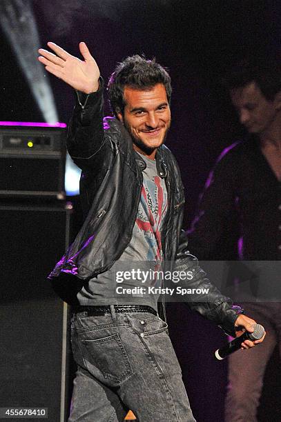 Amir performs onstage during 'Leurs Voix Pour L'Espoir 2014' concert at L'Olympia on September 18, 2014 in Paris, France.