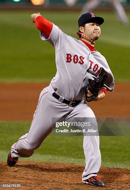 Junichi Tazawa of the Boston Red Sox pitches in the seventh inning during inter-league play against the Pittsburgh Pirates at PNC Park on September...