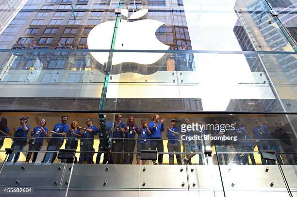 Apple Inc. Employees cheer before opening the doors to the company's George Street store for the sales launch of the iPhone 6 and iPhone 6 Plus in...