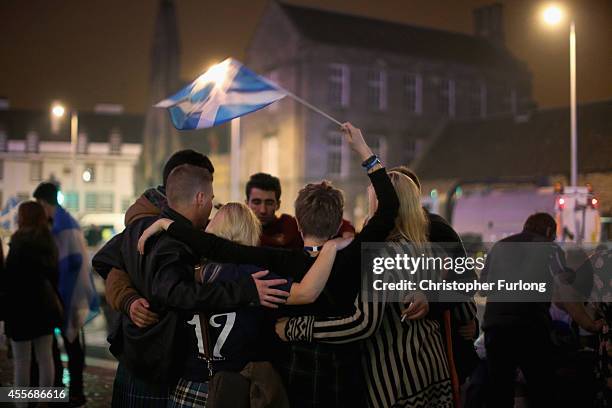 Yes vote campaigners console themselves outside the Scottish Parliament building after the people of Scotland voted no to independence on September...