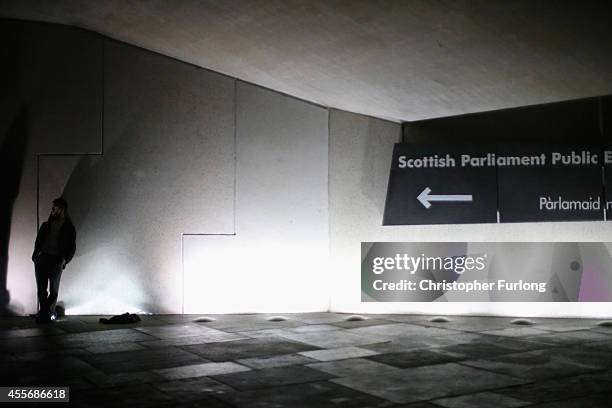 Yes vote campaigner stands outside the Scottish Parliament building after the people of Scotland voted no to independence on September 19, 2014 in...