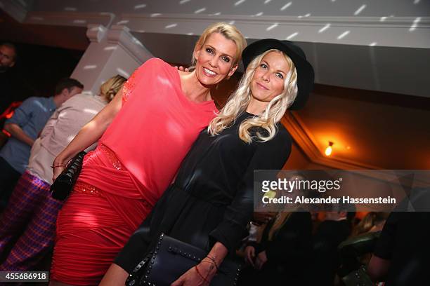 Alexandra Rietz attends with Tina Kaiser the Getty Images Hearts You event at Heart on September 18, 2014 in Munich, Germany.