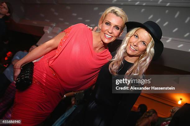 Alexandra Rietz attends with Tina Kaiser the Getty Images Hearts You event at Heart on September 18, 2014 in Munich, Germany.