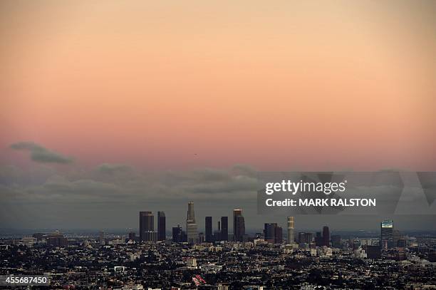 Twilight view of the downtown district of Los Angeles taken from the Hollywood Hills on September 18, 2014. AFP PHOTO/Mark RALSTON