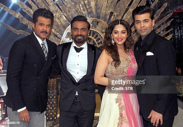Indian Bollywood film actors Anil Kapoor as guest, choreographer-director Remo D'Souza, film actress Madhuri Dixhit and director Karan Johar pose...
