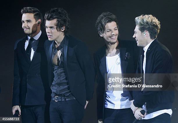 Liam Payne, Harry Styles, Louis Tomlinson and Niall Horan of One Direction perform live at 'X Factor'- The Final on December 12, 2013 in Milan, Italy.