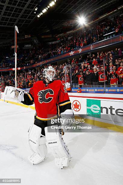 Karri Ramo of the Calgary Flames salutes the crowd after being named the third star of the game against the Carolina Hurricanes at Scotiabank...