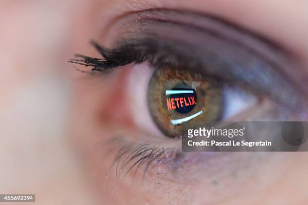 In this photo illustration the Netflix logo is reflected in the eye of a woman on September 19, 2014 in Paris, France. Netflix September 15 launched...