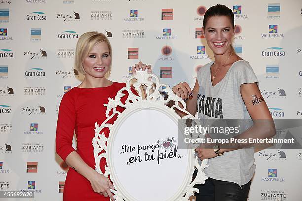 Soraya Arnelas and model Laura Sanchez get charity tatoos during the campaign against cancer 'Me Pongo En Tu Piel' on September 18, 2014 in Madrid,...