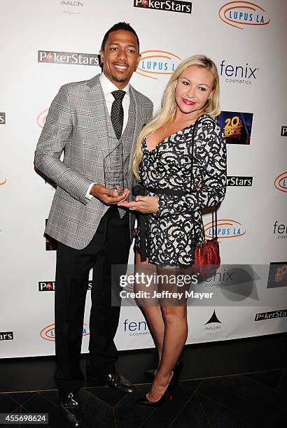 Personality Nick Cannon and Nicole Paxson attend the Stars Get Lucky For Lupus: 6th Annual Poker Tournament at Avalon on September 18, 2014 in...