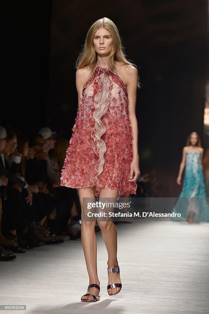 A model walks the runway during the Blumarine show as a part of Milan ...