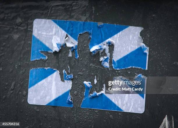 Yes' sticker partially scratched away is seen in central Edinburgh on September 19, 2014 in Edinburgh, Scotland. The majority of Scottish people have...