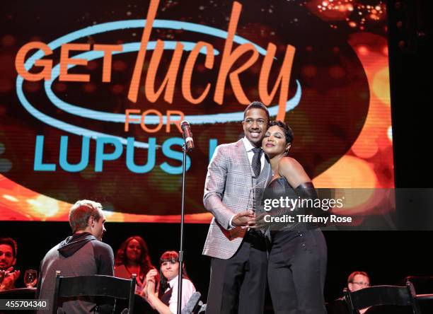 Personality Nick Cannon and singer Toni Braxton attend Get Lucky For Lupus LA on September 18, 2014 in Beverly Hills, California.