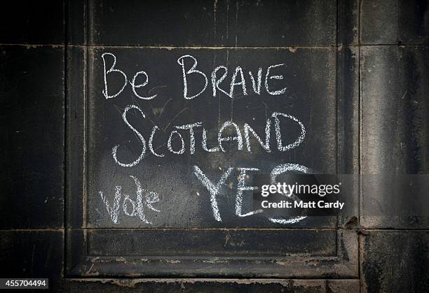 Graffiti written on a wall in support of the Yes vote remains below Edinburgh Castle on September 19, 2014 in Edinburgh, Scotland. The majority of...