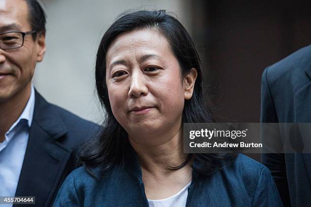 Chief Financial Officer of Alibaba Group Maggie Wu poses for a photo outside the New York Stock Exchange prior to the company's initial price...