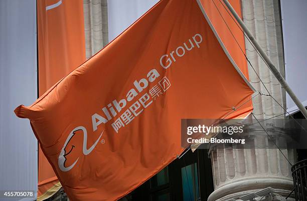 An Alibaba Group Holding Ltd. Flag flies in front of the New York Stock Exchange in New York, U.S., on Friday, Sept. 19, 2014. Alibaba Group Holding...