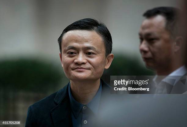 Billionaire Jack Ma, chairman of Alibaba Group Holding Ltd., stands for a photograph in front of the New York Stock Exchange in New York, U.S., on...