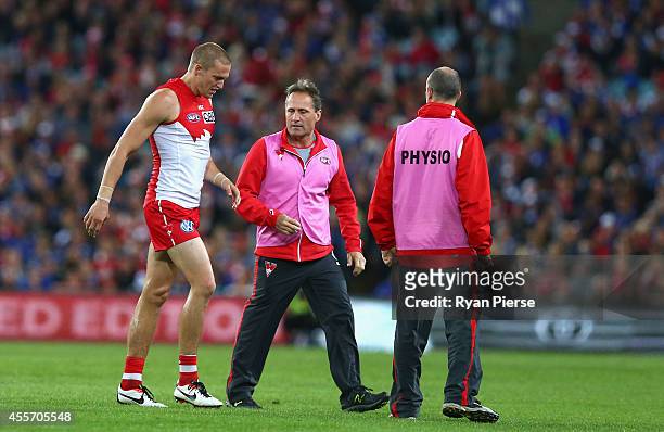 Sam Reid of the Swans leaves the ground with a leg injury during the 1st Preliminary Final AFL match between the Sydney Swans and the North Melbourne...
