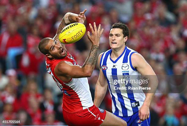 Lance Franklin of the Swans marks over Scott Thompson of the Kangaroos during the 1st Preliminary Final AFL match between the Sydney Swans and the...