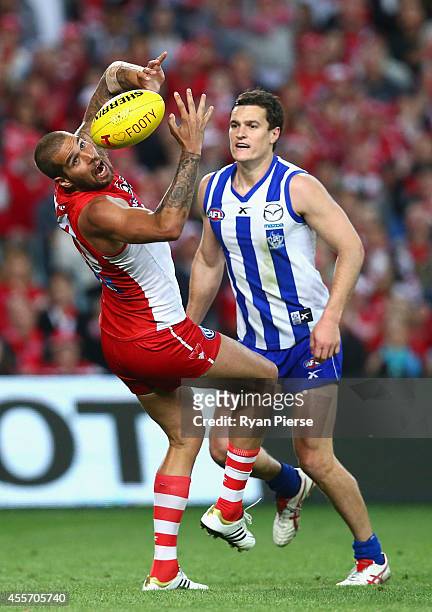 Lance Franklin of the Swans marks over Scott Thompson of the Kangaroos during the 1st Preliminary Final AFL match between the Sydney Swans and the...