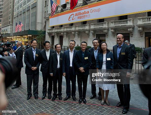 Billionaire Jack Ma, chairman of Alibaba Group Holding Ltd., fourth right, stand for a photograph with Peng Jiang, deputy chief technology officer of...