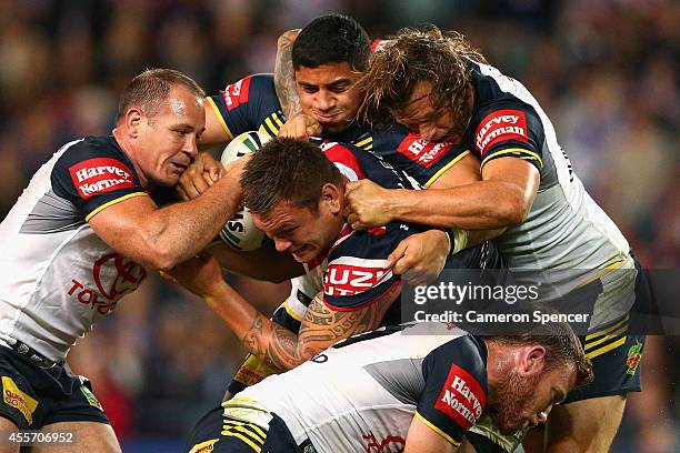 Jared Waerea-Hargreaves of the Roosters is tackled during the 1st NRL Semi Final match between the Sydney Roosters and the North Queensland Cowboys...